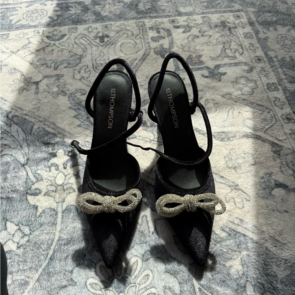 Thompson Black Pointed Toe Slingback Heels with Crystal Bow Accent